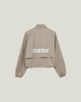 Model wearing Cuera Active Cuera Short Jacket in Taupe, front studio view