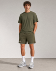 Model wearing Cuera Breathe Active Unifrom in Army, front studio view