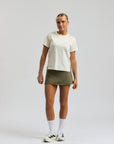 Model wearing Cuera Oncourt Slit Top SS in Off White, front studio view