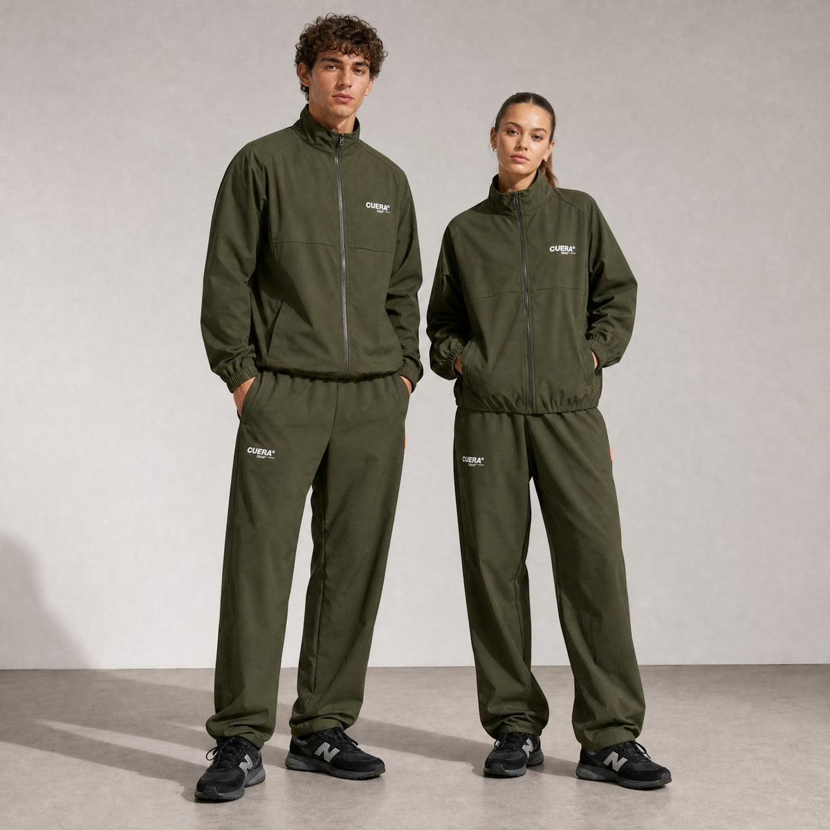 Model wearing Cuera Active Cuera Track Pants in Army, front studio view