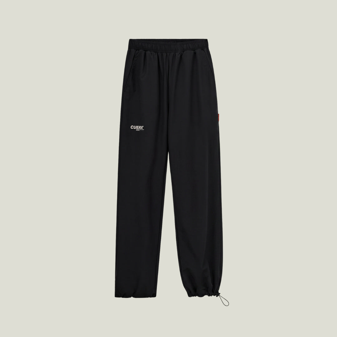 Cuera Active Cuera Track Pants in Black, flat lay front view