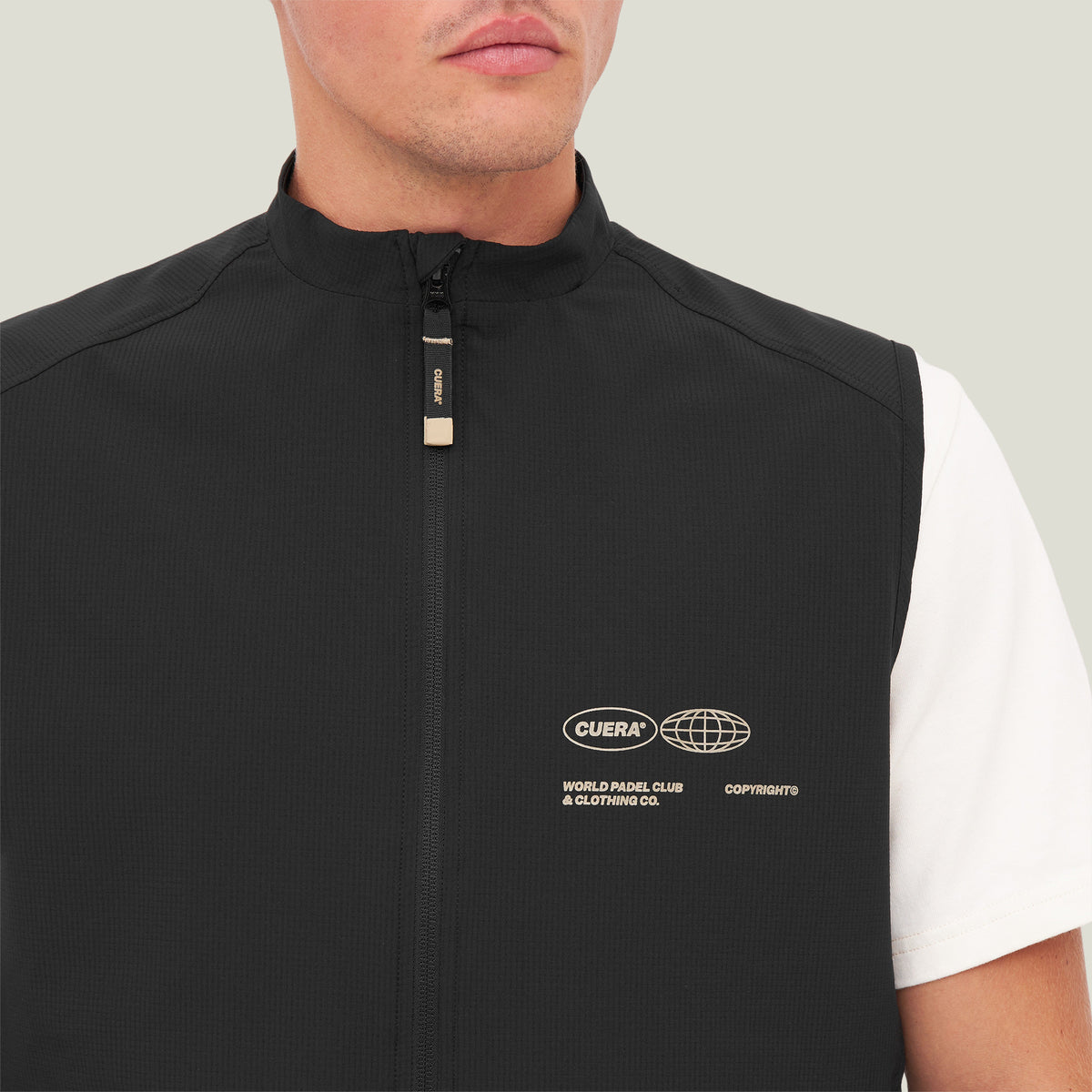 Model wearing Cuera Active Gilet in Black, close-up detail on model