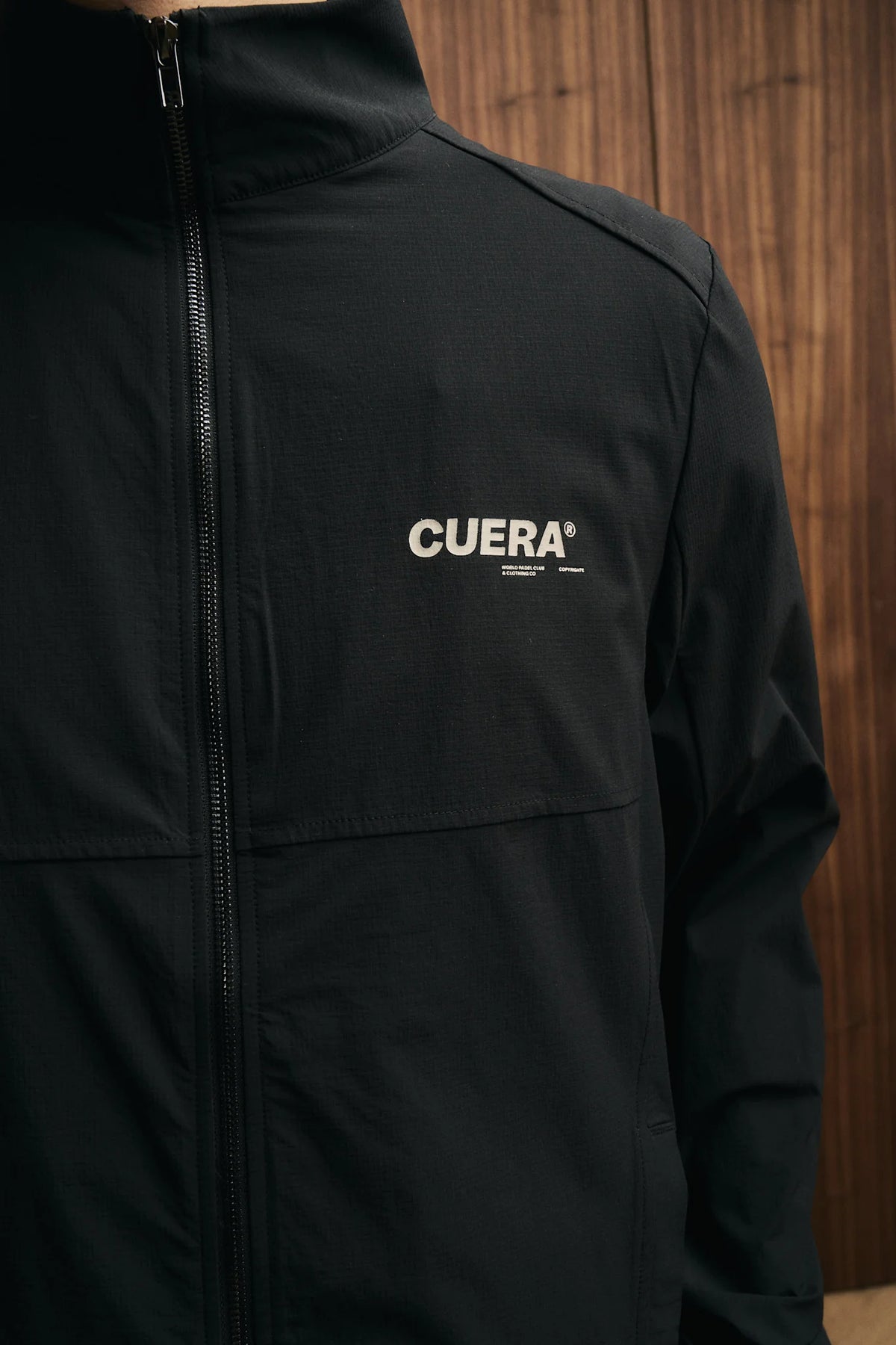 Model wearing Cuera Active Tracksuit Black 2.0 Bundle, close-up detail on model