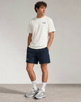 Man wearing Cuera Mens Active Globe Shorts in Navy, front studio view