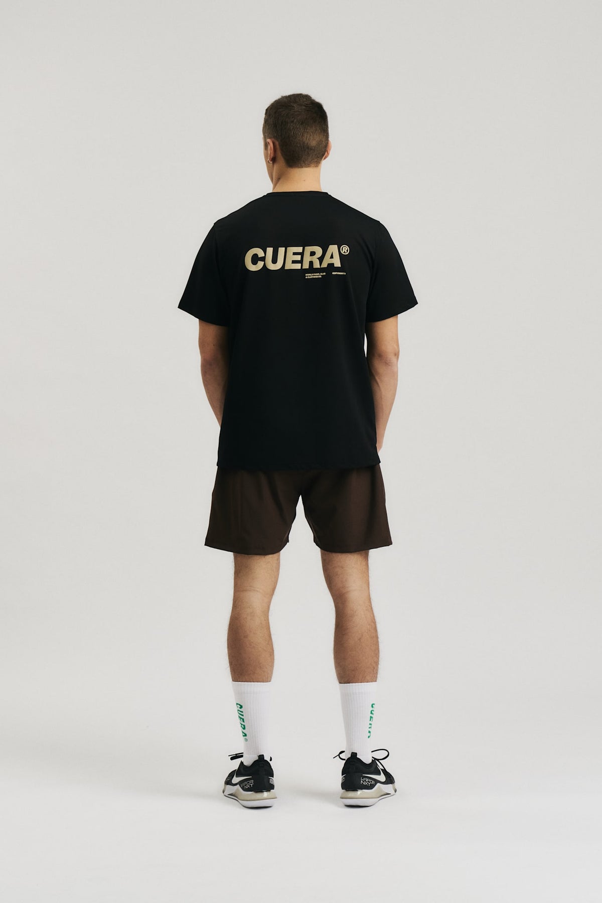 Model wearing Cuera Oncourt Breathe Cuera T-Shirt in Black, back studio view