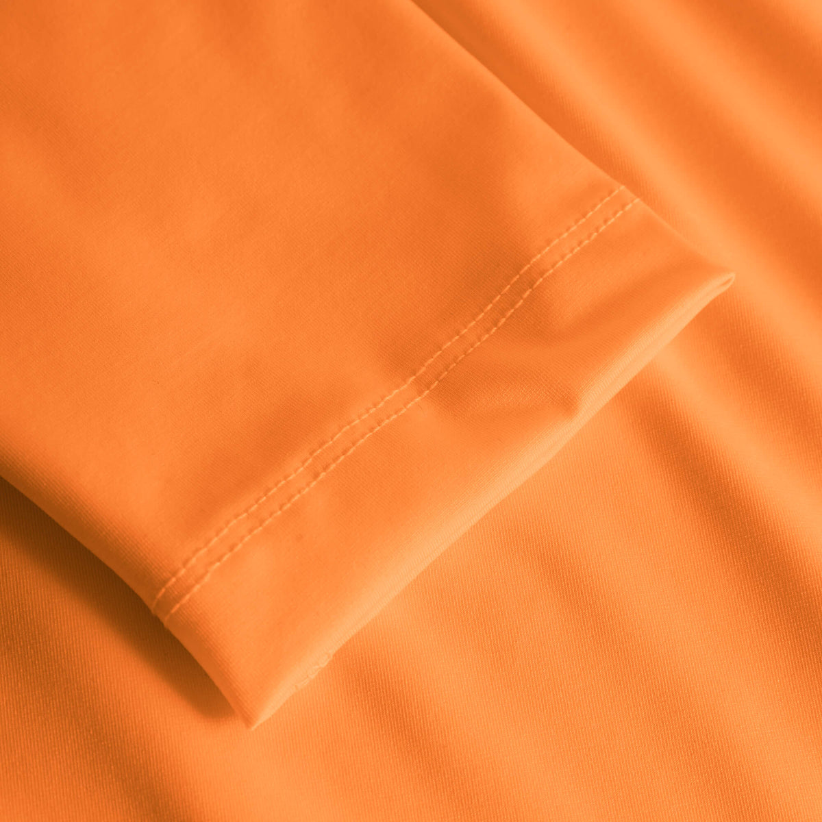 Cuera Oncourt LS Layer T-Shirt in Orange, hem detail