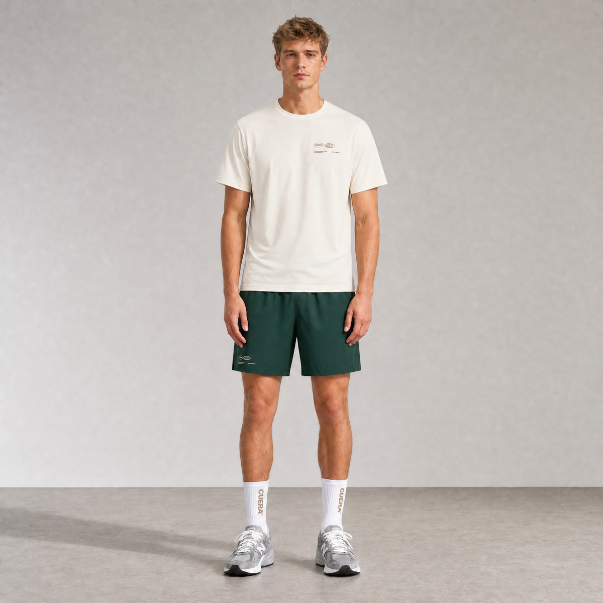 Model wearing Cuera Oncourt Shorts &amp; T-shirt in Court Green &amp; Off White, front studio view