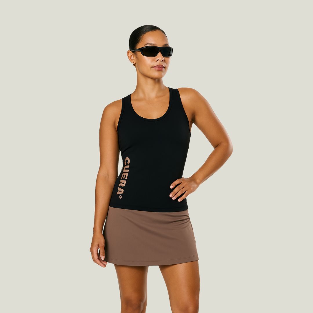 Model wearing Cuera Oncourt Slim Tank Top &amp; Oncourt Cuera Skirt 2-in-1, front studio view